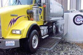 Washes Tires, Wheels, Frame Products Sec. and Under Carriage of the Truck